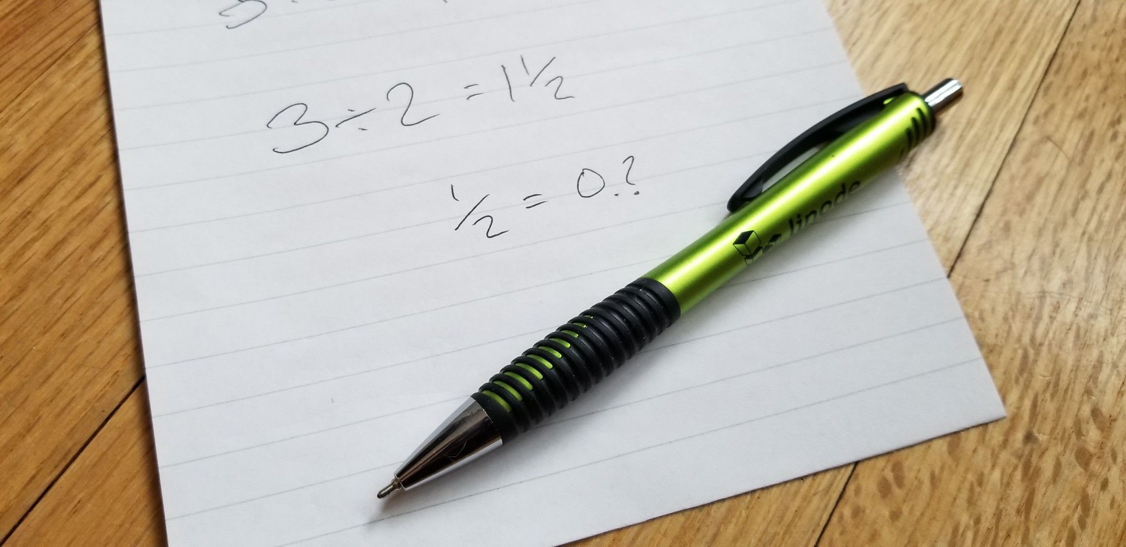 Pen and paper on wooden table